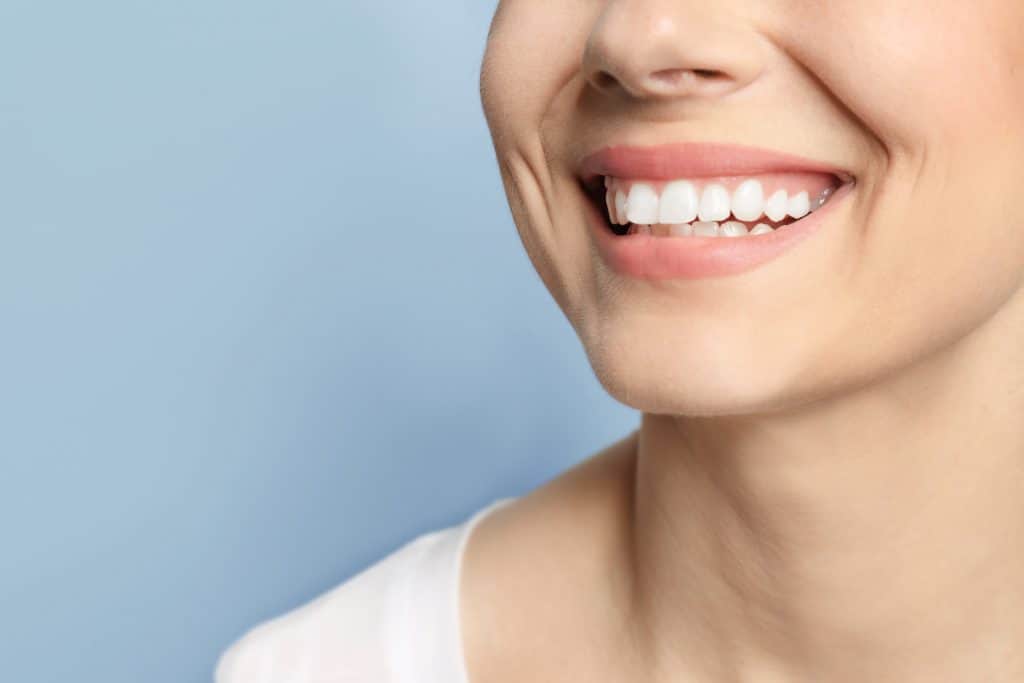 Lady with white teeth showing off her smile