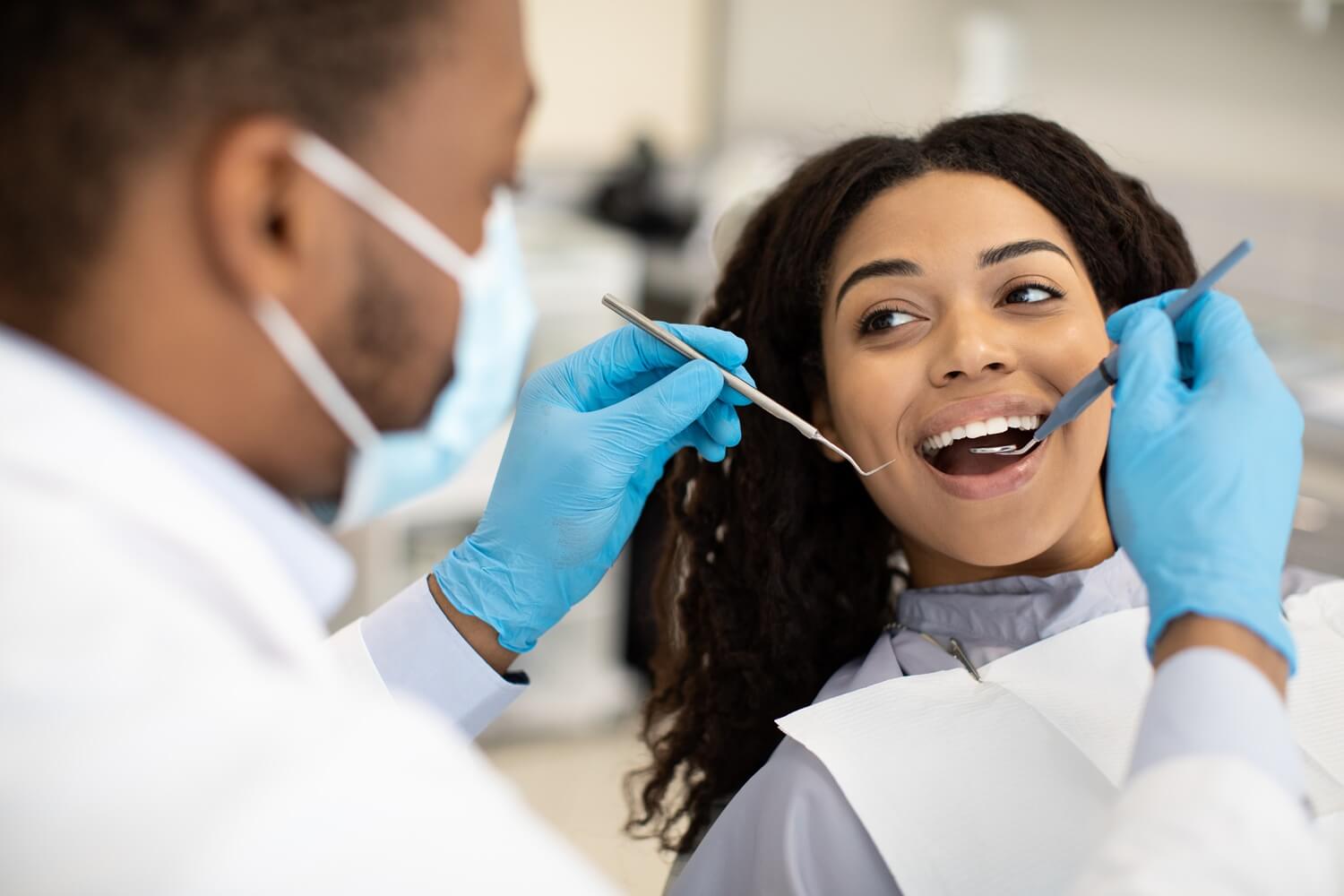 young african woman having dental checkup